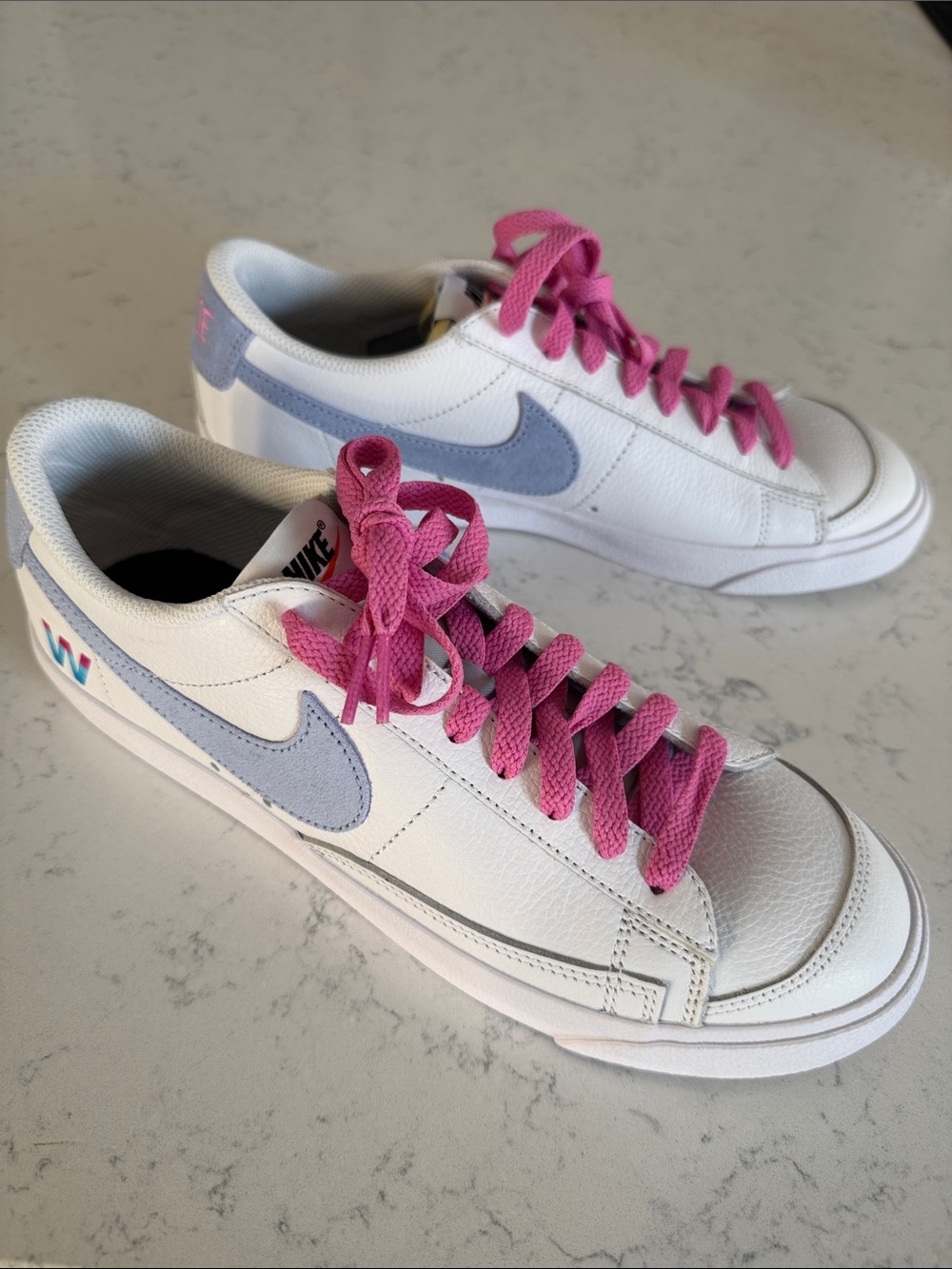 Nike Women’s White Leather Sneakers with Pink Laces and Light Blue Swoosh